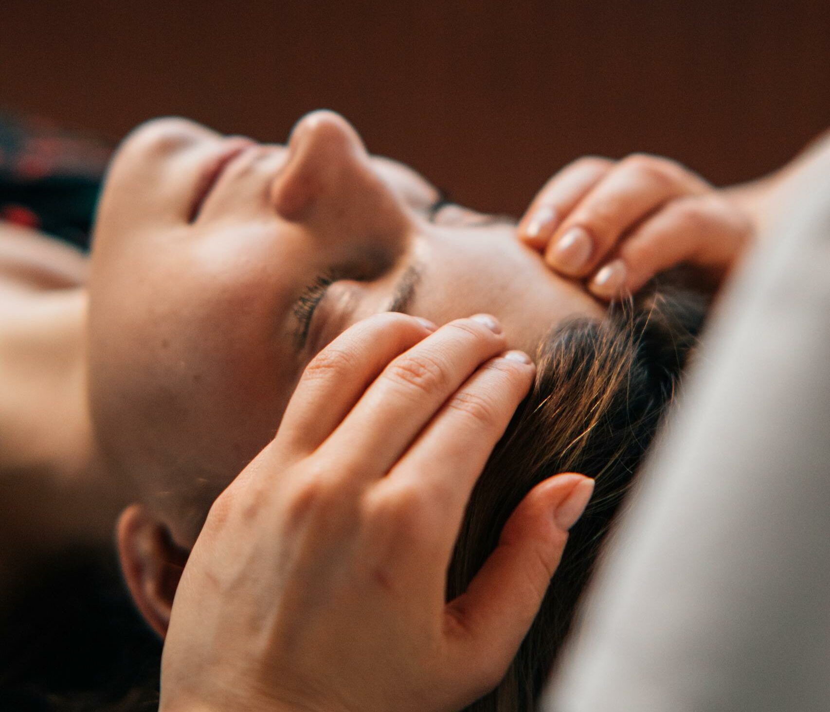 Close-up of a woman receiving a soothing massage at a spa for complete relaxation.
